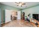 Bedroom with wood flooring and open doors at 6038 Palomaglade Dr, Lithia, FL 33547
