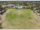 Large community playing field next to the pool area and playground for residents at 6038 Palomaglade Dr, Lithia, FL 33547