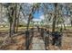 Fully fenced dog park with mature landscaping, providing a secure and scenic area for pets to exercise and socialize at 6038 Palomaglade Dr, Lithia, FL 33547