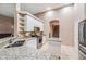 Kitchen with granite countertops, stainless steel appliances, and open shelving at 6038 Palomaglade Dr, Lithia, FL 33547