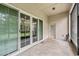 Covered patio showcasing sliding glass doors at 6038 Palomaglade Dr, Lithia, FL 33547