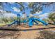 Bright blue playset with multiple slides, designed to provide endless fun and excitement for  at 6038 Palomaglade Dr, Lithia, FL 33547