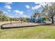 Well-maintained playground with swings and slides, perfect for children to enjoy outdoor activities in a safe environment at 6038 Palomaglade Dr, Lithia, FL 33547
