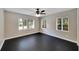Bright bedroom featuring large windows and hardwood floors at 6110 N Suwanee Ave, Tampa, FL 33604