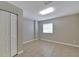 Bright and airy bedroom with closet, window, and tile flooring at 6110 N Suwanee Ave, Tampa, FL 33604