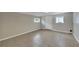 Spacious room with tile floors, natural light and easy backyard access at 6110 N Suwanee Ave, Tampa, FL 33604