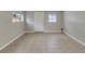 Spacious room with tile floors, natural light and easy backyard access at 6110 N Suwanee Ave, Tampa, FL 33604