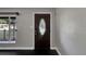 Close-up of an elegant front door with decorative glass and gray wall at 6110 N Suwanee Ave, Tampa, FL 33604