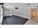 Bright living room featuring hardwood floors and an open floorplan, seamlessly connecting to the kitchen at 6110 N Suwanee Ave, Tampa, FL 33604