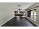 Bright living room with tile and hardwood floors, seamlessly connecting to a modern kitchen at 6110 N Suwanee Ave, Tampa, FL 33604