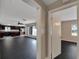View through the open doorway into the living room and kitchen at 6110 N Suwanee Ave, Tampa, FL 33604