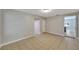 Open living room with neutral paint, tile floors, and lots of natural light at 6110 N Suwanee Ave, Tampa, FL 33604