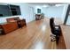 Spacious office area with desk, chair, and storage cabinets, well-lit by large windows at 6234 Neff Lake Rd, Brooksville, FL 34601