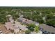 An aerial view showcases the townhouses in a lush, green, residential community at 6420 92Nd N Pl # 1205, Pinellas Park, FL 33782