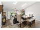 Cozy dining area with modern table set and skylight, adjacent to the living room at 6420 92Nd N Pl # 1205, Pinellas Park, FL 33782
