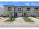 Charming townhome with small trees, driveways, balconies, and a well-maintained facade at 6420 92Nd N Pl # 1205, Pinellas Park, FL 33782