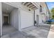 Exterior view of a townhome featuring an attached garage and a welcoming entryway at 6420 92Nd N Pl # 1205, Pinellas Park, FL 33782