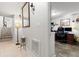 Hallway leading to a staircase and a home office space with wood-look tile at 6420 92Nd N Pl # 1205, Pinellas Park, FL 33782