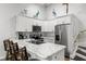Kitchen featuring marble countertops, stainless steel appliances, and bright white cabinetry at 6420 92Nd N Pl # 1205, Pinellas Park, FL 33782