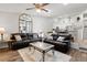 Inviting living room with comfortable leather sofas and an open floor plan to the kitchen at 6420 92Nd N Pl # 1205, Pinellas Park, FL 33782