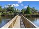 Charming pond featuring a gazebo and a wooden bridge connecting the water at 6420 92Nd N Pl # 1205, Pinellas Park, FL 33782
