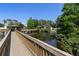 Picturesque view of the community pond with a gazebo and fountain at 6420 92Nd N Pl # 1205, Pinellas Park, FL 33782