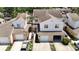 Overhead shot of well-kept townhouses, each with a garage and driveway, nestled in a tranquil setting at 6980 Ulmerton Rd # 7C, Largo, FL 33771