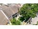 Aerial view of backyard featuring a fenced-in artificial lawn and screened porch at 6980 Ulmerton Rd # 7C, Largo, FL 33771