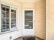 Exterior image featuring the home's front door and a decorative patterned doormat at 6980 Ulmerton Rd # 7C, Largo, FL 33771