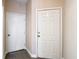 Hallway featuring doors and neutral paint at 6980 Ulmerton Rd # 7C, Largo, FL 33771