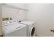 Laundry room with washer, dryer and wire shelving at 6980 Ulmerton Rd # 7C, Largo, FL 33771