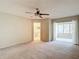 Spacious bedroom features a ceiling fan, access to the bathroom, and a bright window at 6980 Ulmerton Rd # 7C, Largo, FL 33771