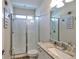 Modern bathroom with a tiled shower and granite countertops at 7307 S Morton St, Tampa, FL 33616