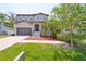 Charming two-story home featuring a well-maintained lawn and a two-car garage at 7307 S Morton St, Tampa, FL 33616
