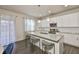 Modern kitchen featuring stainless steel appliances, granite counters and white cabinets at 7307 S Morton St, Tampa, FL 33616