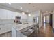 Modern kitchen with a center island, pendant lights, and stainless steel appliances at 7307 S Morton St, Tampa, FL 33616