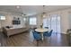 Spacious living room with wood-look floors, stylish furniture, and ample natural light at 7307 S Morton St, Tampa, FL 33616
