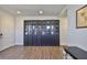 Home office featuring a large built in book case and attractive flooring at 7307 S Morton St, Tampa, FL 33616