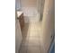 Well lit bathroom with a combined shower and tub with glass door, tile floor, vanity and drawers at 7504 Turtle View Dr, Ruskin, FL 33573