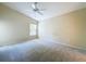 Bedroom with neutral carpet and a window that provides natural light, creating a simple, calm space at 7504 Turtle View Dr, Ruskin, FL 33573