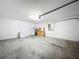 Spacious garage with white walls, concrete floor, and ample room for storage and parking at 7504 Turtle View Dr, Ruskin, FL 33573