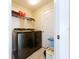 Functional laundry room featuring modern washer and dryer units at 7504 Turtle View Dr, Ruskin, FL 33573