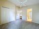 The main bedroom has a ceiling fan, carpeting, and access to ensuite bathroom at 7504 Turtle View Dr, Ruskin, FL 33573