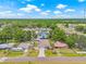 An aerial view shows a property in close proximity to a variety of neighborhood homes and plentiful foliage at 7612 S 36Th Ave, Tampa, FL 33619