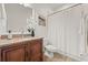 Bathroom features a granite vanity and shower with white curtain at 7612 S 36Th Ave, Tampa, FL 33619