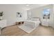 Serene bedroom featuring a plush bed, soft lighting, and light wood floors that create a calm retreat at 7612 S 36Th Ave, Tampa, FL 33619