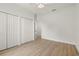 Spacious bedroom with light wood floors, closet, and neutral walls for easy customization at 7612 S 36Th Ave, Tampa, FL 33619