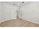 This bedroom features light-colored floors and double door closets at 7612 S 36Th Ave, Tampa, FL 33619