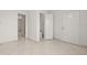 Tile flooring in a room with multiple doorways, including one leading to the bathroom at 7612 S 36Th Ave, Tampa, FL 33619