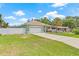 Spacious single-story house with a well-maintained lawn, long driveway and an attached two car garage at 7612 S 36Th Ave, Tampa, FL 33619